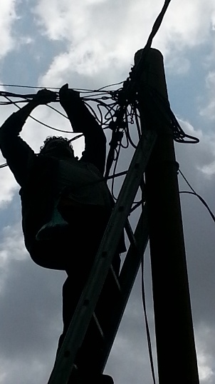 Waleed repairing a power line